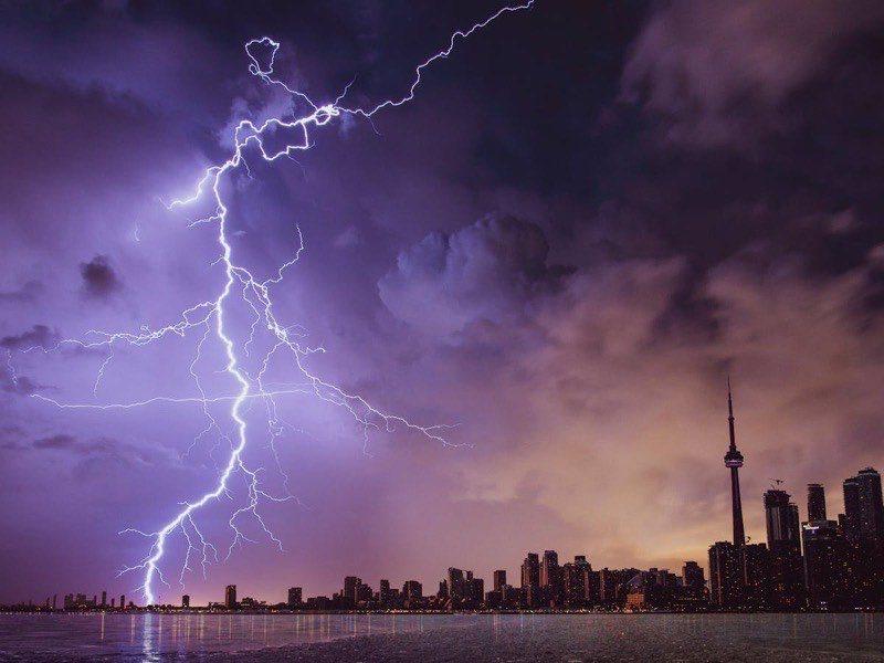 Dark storm clouds gathering over buildings